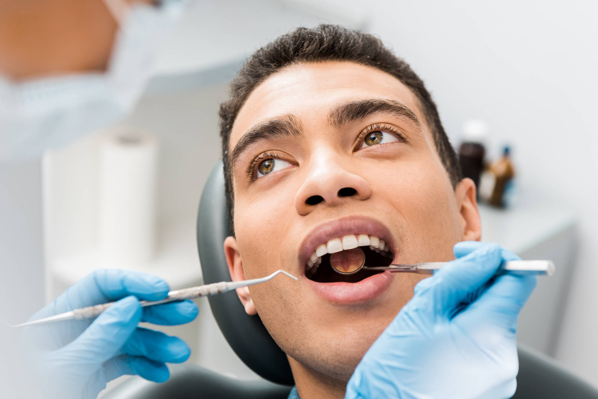 Man at the dentist for a Tooth Extraction Denton