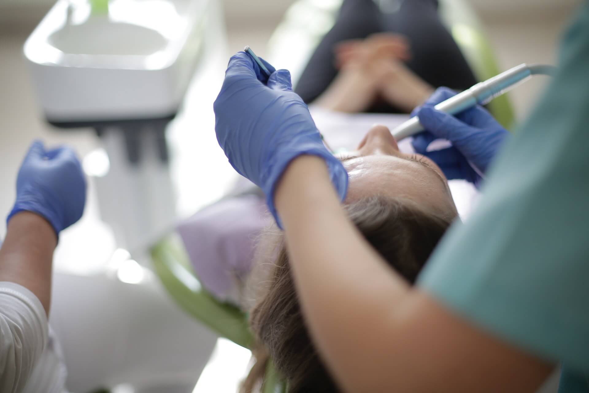 Woman at the dentist getting treatment after an Oral Trauma Denton