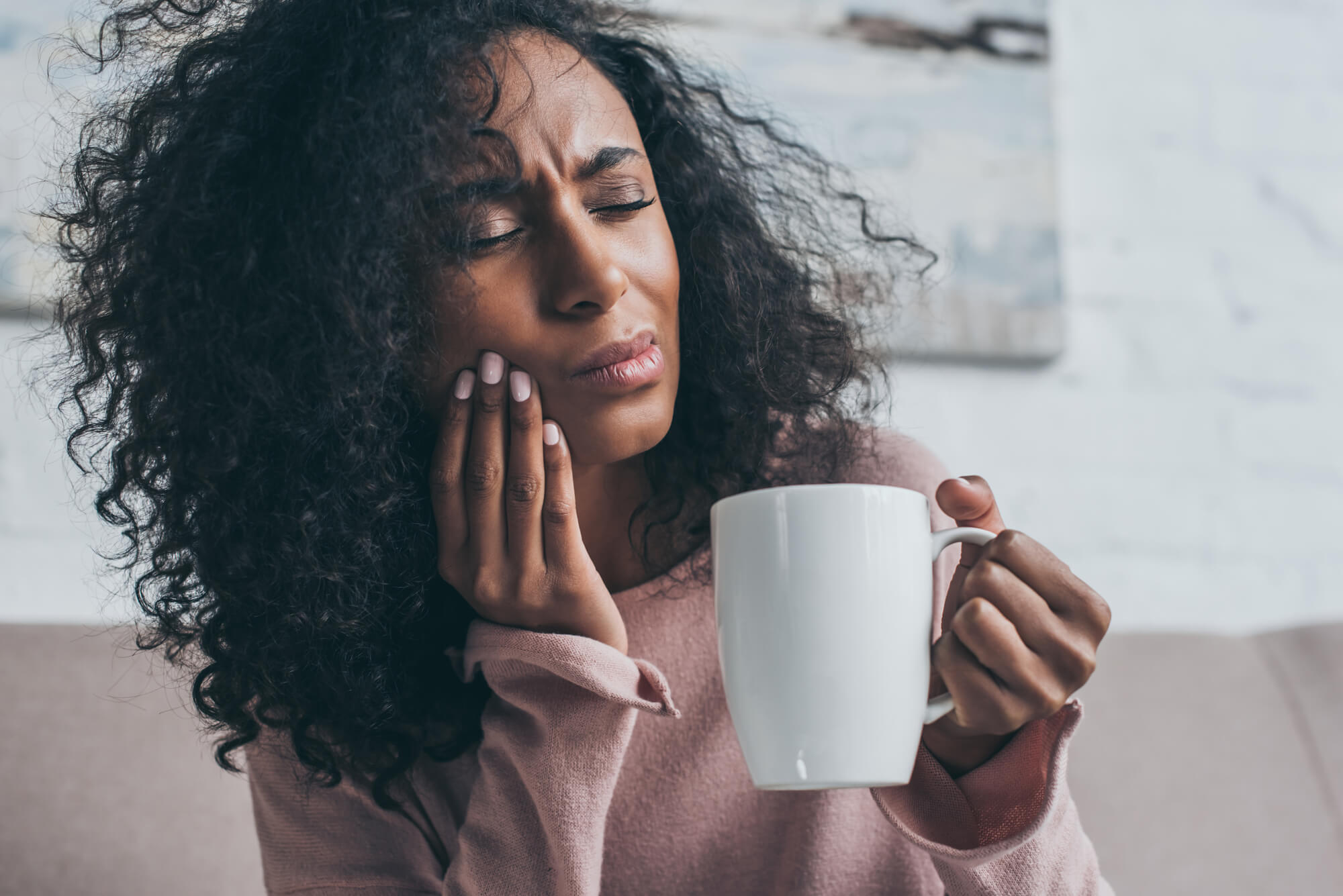 Woman in pain after visiting Oral Surgeon Plano