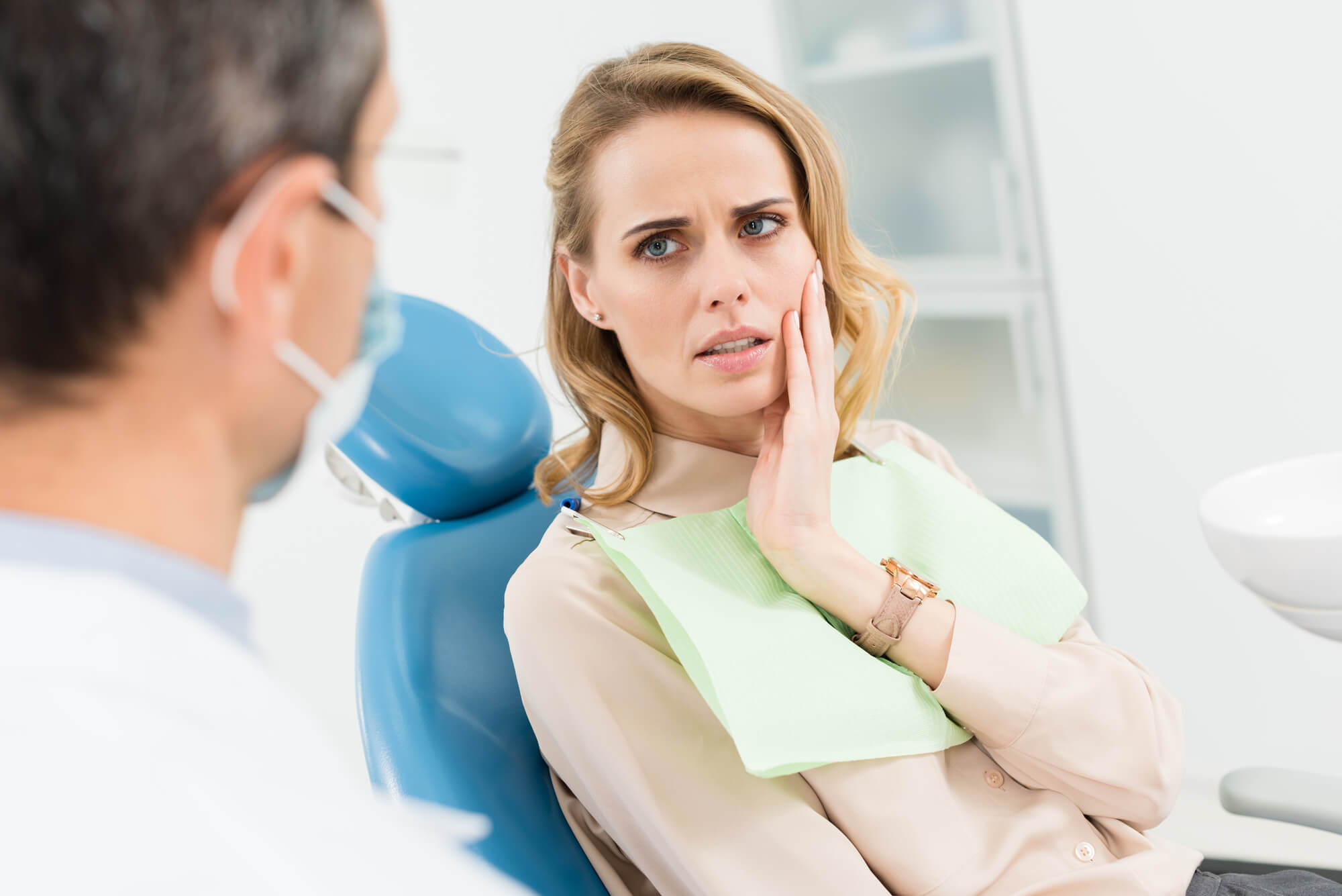 Woman at the dentist because of pain with her Wisdom Teeth in Denton TX