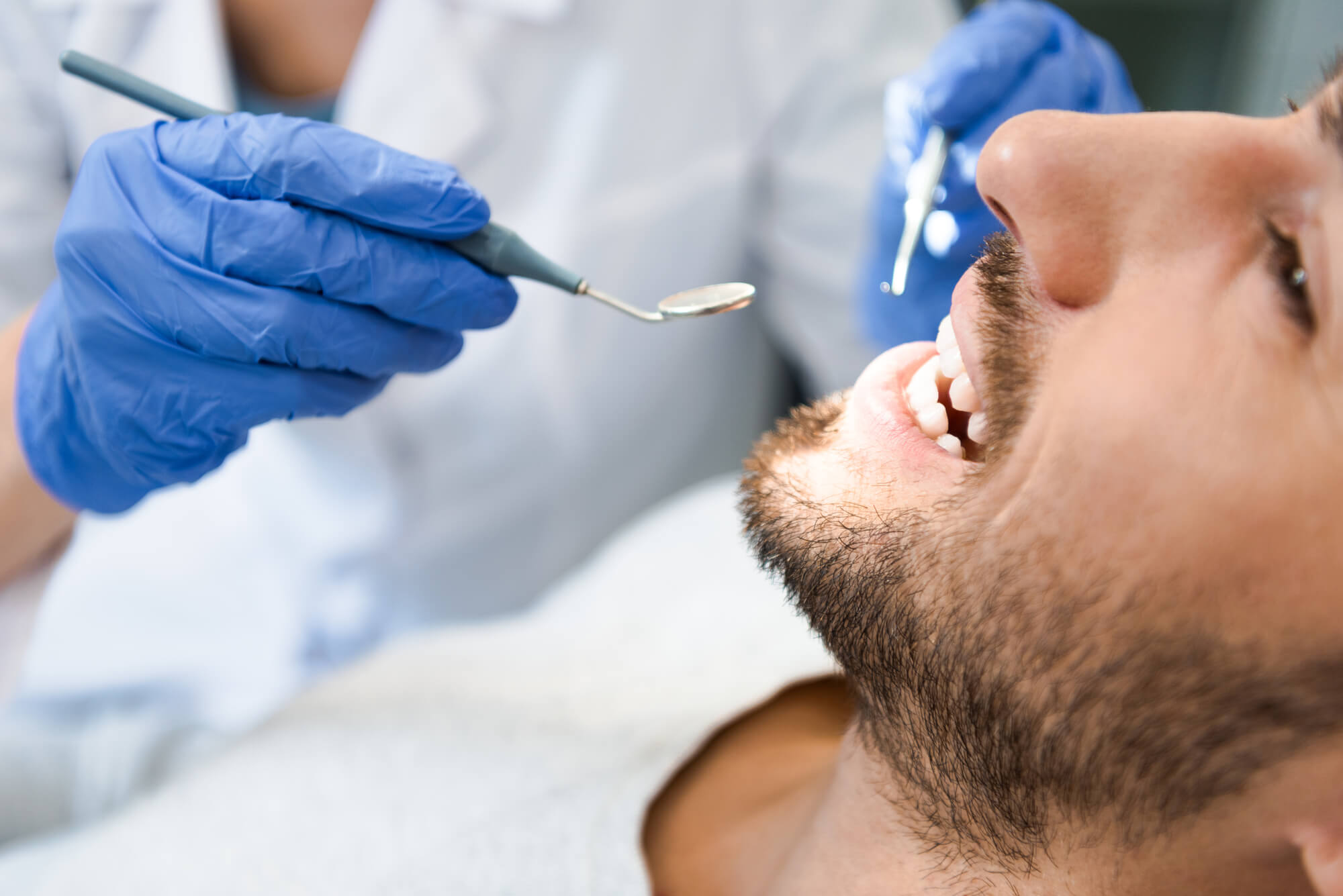 Closeup of a dentist performing Surgical Dental Implants in Plano
