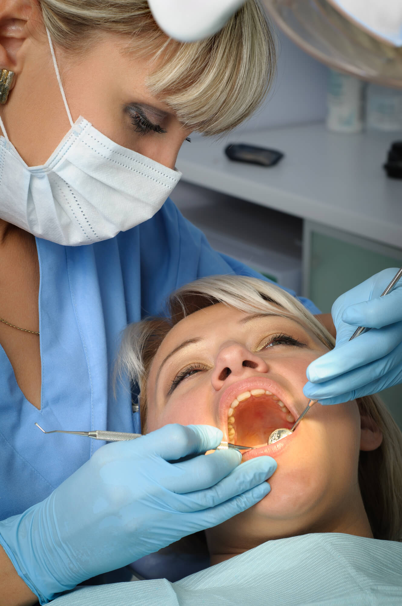 Dentist preparing for extractions in 76210