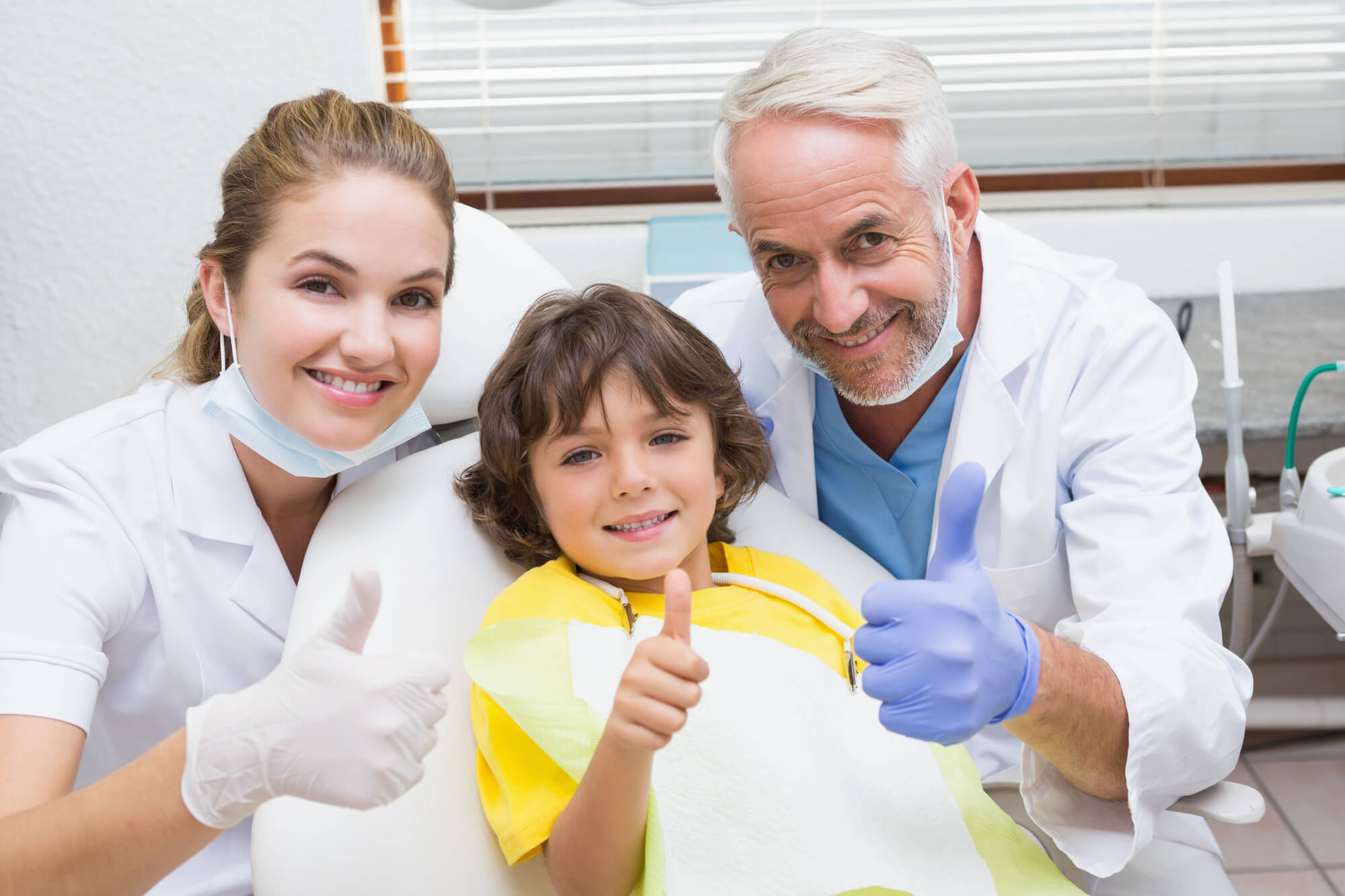 kid smiles after a dental surgery in 75075