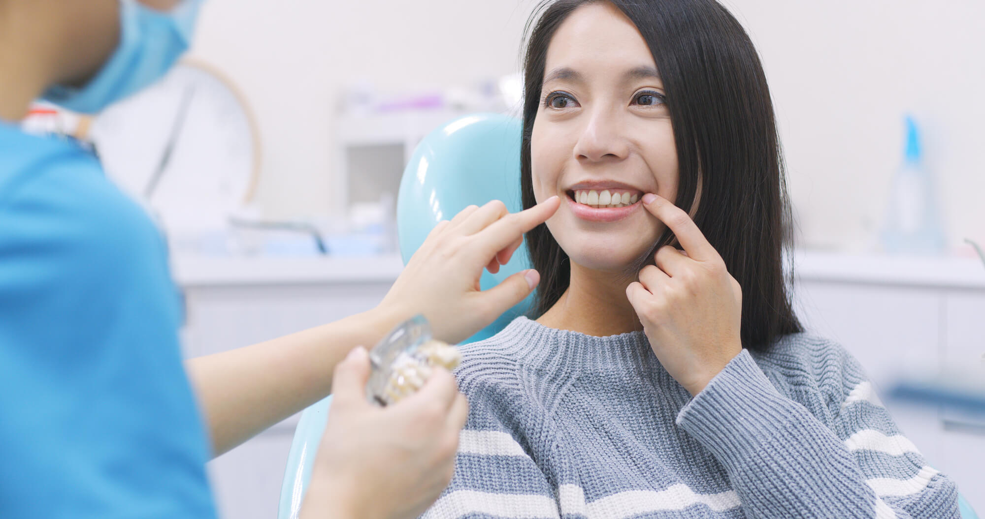 dentist check newly-placed dental implants in Denton